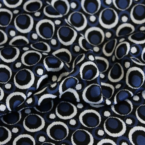 Tricot blauw met wit en zwarte cirkels